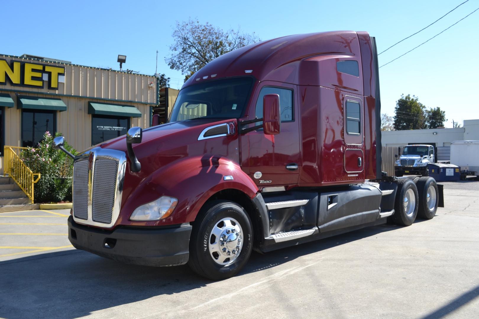 2017 MAROON KENWORTH T680 with an PACCAR MX13 12.9L 455HP engine, ULTRASHIFT 10SPD AUTOMATIC transmission, located at 9172 North Fwy, Houston, TX, 77037, (713) 910-6868, 29.887470, -95.411903 - 76" RAISED ROOF SLEEPER, DOUBLE BUNK, DUAL 135 GALLON FUEL TANKS, WB: 230", RATIO: 3.36, ALUMINUM WHEELS, BUILT-IN NAVIGATION, CRUISE CONTROL, POWER WINDOWS, LOCKS, & MIRRORS, ENGINE BRAKE, 53,200LB GVWR - Photo#0